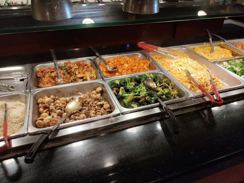 Printed menu beside buffet items